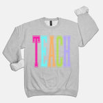 Teach Rainbow Varsity Crewneck Sweatshirt